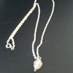 Silver necklace with faberge egg